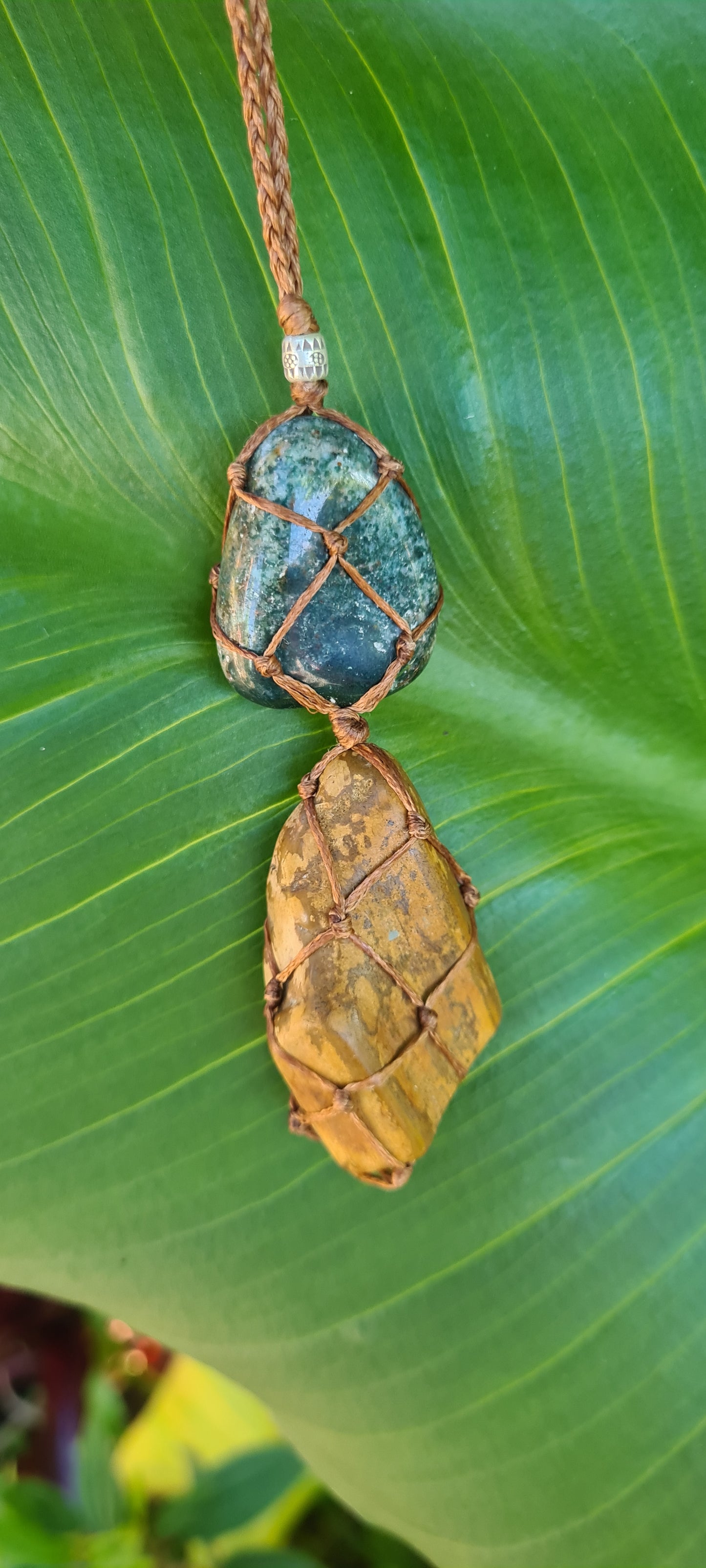 Petrified wood with moss agate macrame pendant